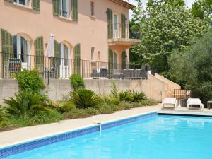 a swimming pool in front of a house at Modern Villa with Private Pool in Cabris in Cabris