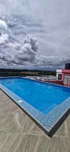a large swimming pool on top of a building at Homely studio Apartment 2 in Mombasa