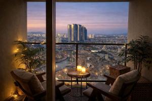 a balcony with a view of a city at Shalom Gold Terrace in Paju