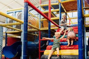 a group of children playing on a playground at Tasman Holiday Parks - North Star in Hastings Point +76 photos