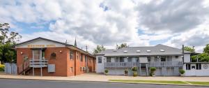a building on the side of a street at Bunkhouse Motel Cooma in Cooma