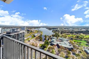 a view of a river from the balcony of a building at Chic 1-Bed with Stunning Lake View & Indoor Pool in Belconnen