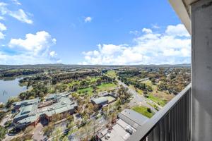 arial view of a city from a balcony at Chic 1-Bed with Stunning Lake View & Indoor Pool in Belconnen