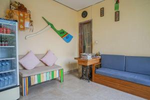 a living room with a couch and a table at Home 21 Bali in Sanur