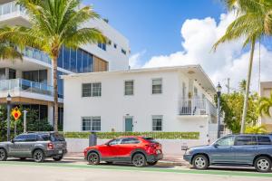 three cars parked in front of a building at Instant Stay Ocean Drive in Miami Beach