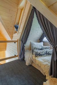 a bedroom with a bed in a attic at Osada Poronin in Poronin