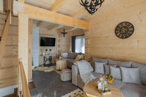 a living room with a couch and a table at Osada Poronin in Poronin