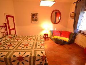 A bed or beds in a room at Holiday Home in Tuscany near Abetone Ski Lift
