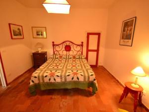 A bed or beds in a room at Holiday Home in Tuscany near Abetone Ski Lift