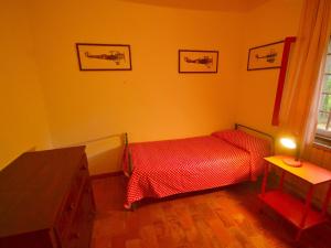 A bed or beds in a room at Holiday Home in Tuscany near Abetone Ski Lift