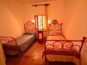 A bed or beds in a room at Holiday Home in Tuscany near Abetone Ski Lift