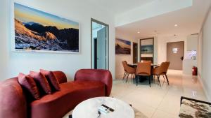 a living room with a couch and a table at Bay Win La,mer Butik in Kota Kinabalu