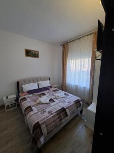 a bedroom with a large bed and a window at Altan's Gold in Hangul +31 photos
