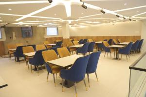 a dining room with tables and chairs at Hotel Vivaan - Walk to Banke Bihari Temple in Vrindāvan
