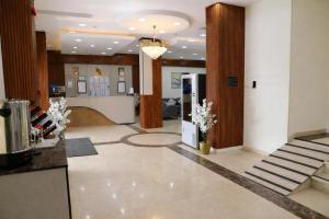 a lobby with a reception desk in a building at Almawasem Alarbaa for Serviced Apartments - Standard in Al Jubail