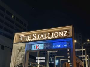 a building with a sign on it at night at Stallionz by MyKey in Ipoh