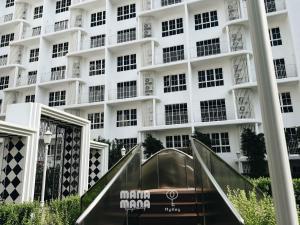 a building with a staircase in front of it at Stallionz by MyKey in Ipoh