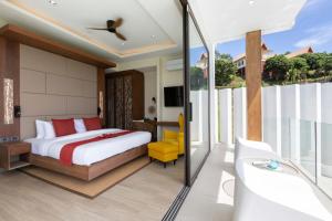 a bedroom with a king sized bed and a tub at Luxury Sea View Jungle Beach Villa Walk to Beach in Ban Bang Po +76 photos
