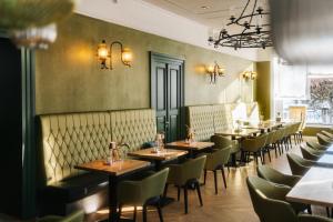 a row of tables and chairs in a restaurant at Schloss und Gut Liebenberg in Liebenberg +40 photos