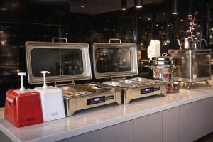 a counter with three monitors on top at Bonnie City Hotel in Antalya
