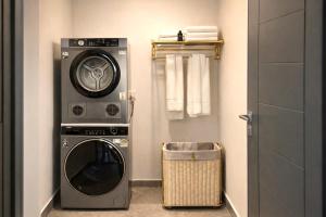 a washer and dryer in a room with at Vantara Villa with Activity Ice Bath in Chiang Mai