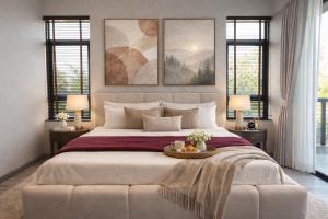 a bedroom with a large bed with a table on it at Vantara Villa with Activity Ice Bath in Chiang Mai