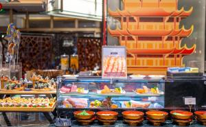 a display of food in a store with plates of food at Shangri-La Wuhan, Interchange hub of three metro lines,Adjacent to the MixC in Wuhan