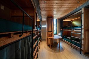 a room with two bunk beds and a table at The Memory Danang Boutique in Danang