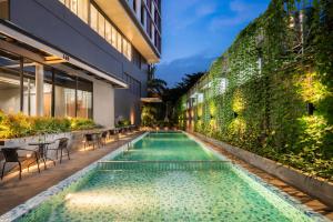 an infinity pool in the middle of a building at Mercure Jakarta Grogol in Jakarta