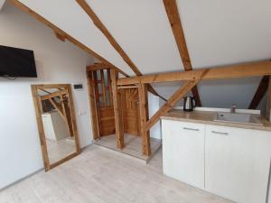 a kitchen with a sink and a counter top at Vėtrungėlė in Nida +12 photos