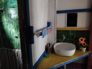 a bathroom with a white sink on a counter at Salote homestay in Lautoka