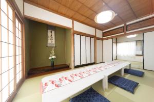 a room with windows and a bench in a room at Miraie Yokkaichi Hazunaka in Yokkaichi +18 photos