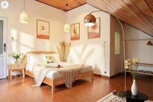 a bedroom with a bed in a room at GreenMeadow Central Boutique in Da Lat