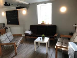 a living room with a couch and a table at Ferienhof Martens in Sörup