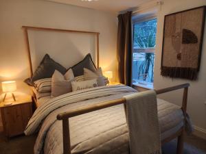 a bedroom with a large bed and a window at Seashell Retreat in Bournemouth
