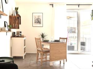 a kitchen with a table and chairs and a dining room at COZEE - Central Apartment with Netflix in Kaiserslautern
