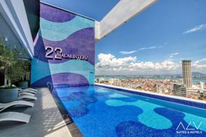a swimming pool on the roof of a building at 22 Macalisterz by ALV in George Town