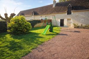 a playground in the yard of a house at LES CHESNEAUX in Loches