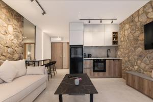 a living room with a couch and a table at Aqua Lora in Nikiana