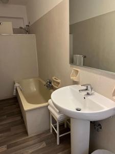 a bathroom with a sink and a bath tub at G&D Winter Home in Milano Marittima +28 photos