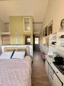 a bedroom with a bed and a counter in it at Bel-Air des Collines in Saint-Martin-dʼAoût