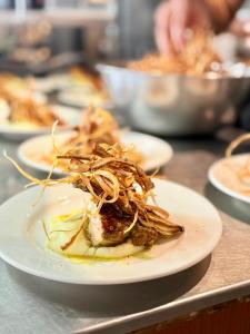 a plate of food sitting on a table at LowPressure Surf Guesthouse in Donghe