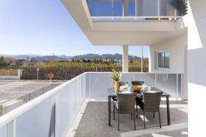 a view from the balcony of a house with a table and chairs at AT Ponent I B3 in La Playa de la Torre de Piles