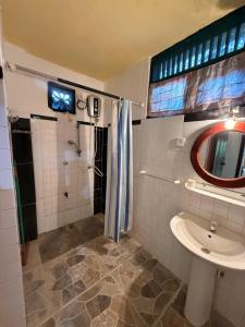 a bathroom with a shower and a sink at Hill Side Kings Villa (Colonial Bungalow) in Hikkaduwa +125 photos