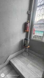 a corner of a room with a table and a window at Sree jee stay in Varanasi