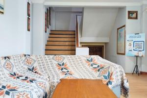 a living room with a couch with a table at NamRoom at Margot Jaksa in Jakarta