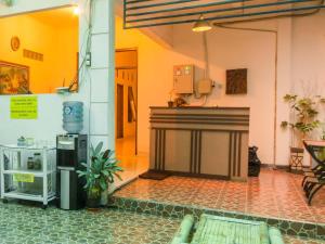 a living room with a fireplace in a building at RedDoorz @ Seturan Raya in Yogyakarta +25 photos