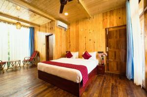 a bedroom with a large bed in a wooden room at SUN VIEW Beach Resort in Varkala +78 photos