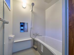 a bathroom with a shower and a sink at The Cross Inn Gujo in Gujo +15 photos
