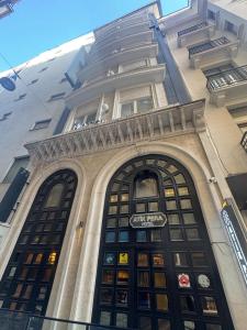 a building with a large door with a sign on it at ATiK PERA in Istanbul